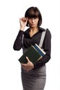 Haughty brunette schoolgirl hold books in the hand