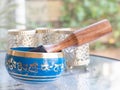 Haulerwijk - march 07 2020: Haulerwijk, The Netherlands. blue and golden indian singing bowl made of seven metals with a