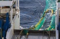Hauling otter trawl fishing nets