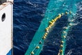 Hauling otter trawl fishing nets Royalty Free Stock Photo