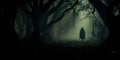 haunted forest with fog rolling through the trees and mysterious figures lurking in the shadows. Generative Ai Royalty Free Stock Photo