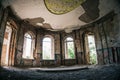 Haunted mansion, abandoned ancient building inside interior with arch windows Royalty Free Stock Photo
