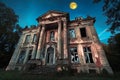 Haunting old mansion illuminated by a ghostly moonlight in a decaying forest at twilight Royalty Free Stock Photo