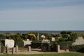 Haurvig Kirke cemetery on sunny day with blue sky, Jutland, Denmark