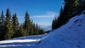 Haus im Ennstal, Steiermark/Austria - March 31 2017: Views half way on the blue piste and hiking trail on a snowy Hauser Kaibling