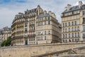 Haussmann apartment building along banks of the Seine river in Paris Royalty Free Stock Photo