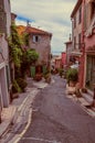 View of alley with houses in Haut-de-Cagnes, a pleasant village on top of a hill, near Nice.
