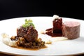 Haute cuisine, grilled veal fillet steak,veal tail with a sauce of port, morels, lentils Royalty Free Stock Photo