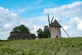 View of the historic windmill Moulin de Pierre and miller`s house in Hauville in Normandy Royalty Free Stock Photo