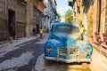 Street scene with an old rusty american car in Havana