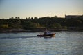 A pilot boat moves along the coastline in the early morning. Havana Harbor, Cuba