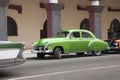 American classic car from the 50s in green color parked in central street of the city of Havana, Royalty Free Stock Photo