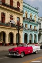 Colorful buildings and old classic american car, historic colonial architecture on Paseo del Prado Royalty Free Stock Photo