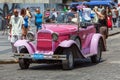 HAVANA, CUBA - APRIL 1, 2012: Really old antique car in front of Royalty Free Stock Photo