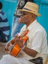 HAVANA - CUBA APRIL 2017- STREET MUSICIAN PLAYS GUITAR FOR NEWLY