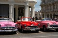 Havana, Cuba - August 26 2018: Next to the Manzana hotel in Old Havana there are many classic cars that are used as taxis. Royalty Free Stock Photo