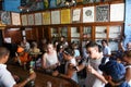 People drinking and listenting at music in the bar of Bodeguita del medio in Havana on Cuba Royalty Free Stock Photo