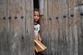 Havana, Cuba, August 14th, 2018: Little boy staying at the home gate in Havana