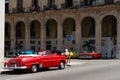 Havana, Cuba - August 25 2018: There are three classic taxis next to the Gran Hotel Manzana Kempiski in Old Havana. Royalty Free Stock Photo