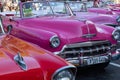 HAVANA, CUBA - DECEMBER 10, 2019: Havana Cuba Classic Cars. Typcal Havana urban scene with colorful buildings and old cars Royalty Free Stock Photo