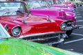 HAVANA, CUBA - DECEMBER 10, 2019: Havana Cuba Classic Cars. Typcal Havana urban scene with colorful buildings and old cars Royalty Free Stock Photo