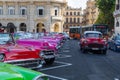 HAVANA, CUBA - DECEMBER 10, 2019: Havana Cuba Classic Cars. Typcal Havana urban scene with colorful buildings and old cars Royalty Free Stock Photo