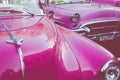 HAVANA, CUBA - DECEMBER 10, 2019: Havana Cuba Classic Cars. Typcal Havana urban scene with colorful buildings and old cars Royalty Free Stock Photo