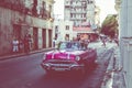 HAVANA, CUBA - DECEMBER 10, 2019: Havana Cuba Classic Cars. Typcal Havana urban scene with colorful buildings and old cars Royalty Free Stock Photo