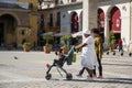Cuban family walks through the center of Havana