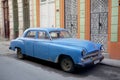 HAVANA, CUBA - 20 December 2016 : Old American cars are still a common sight in the backstreets of Havana, Cuba. Many are used as