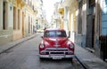 HAVANA, CUBA - 20 December 2016 : Old American cars are still a common sight in the backstreets of Havana, Cuba. Many are used as