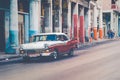 HAVANA, CUBA - DECEMBER 10, 2019: Vintage colored classic american cars in Old Havana, Cuba Royalty Free Stock Photo