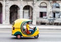 HAVANA, CUBA - FEB 22, 2016: Coco taxi rides along the famous seaside drive Malecon in Havan Royalty Free Stock Photo