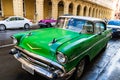 Green classic American car on the streets of Havana, tourist attraction Royalty Free Stock Photo