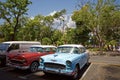 Street scene with old American cars in downtown Havana Royalty Free Stock Photo