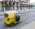 Yellow scooter cab in Havana Cuba