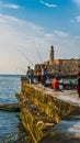 Havana, Cuba. June 2018. El Malecon of Havana: cuban people fishing at sunset.