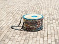 Small colorful musical drum left in street