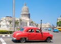 Classic car next to the Capitol building in Old Havana