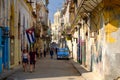 Cuban flags, old car and colorful buildings in Old Havana Royalty Free Stock Photo