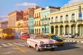 Classic old cars and colorful buildings in downtown Havana Royalty Free Stock Photo