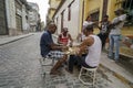 Cuban men playing game of dominoes that is very popular in Cuba