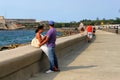 HAVANA, CUBA - MAY 15, 2012: An unknown young couple on the Malecon promenade Royalty Free Stock Photo