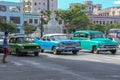 Havana,Cuba-November 2017.Old classic American car driving in the city.Cuban street with vintage cars.Iconic sight of Cuba. Royalty Free Stock Photo