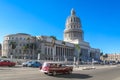 Havana,Cuba-November 2017.Old classic American car driving in front of the Capitol.Cuban street with vintage cars.Iconic sight of