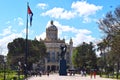 HAVANA, CUBA NOVEMBER, 2019:Parque Central Central Park with palms, statue of Jose Marti, national flag of Cuba and Gran Teatro de