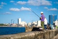 People fishing on the Malecon seawall in Havana