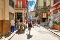 rban scene with people and decaying buildings in Old Havana