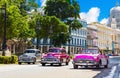 American gray, pink and purple 1953 convertible vintage car on the main street Jose Marti in the old town from Havana City Cuba -