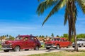 American red brown vintage cars parked under blue sky near the beach in Havana Cuba - Serie Cuba Royalty Free Stock Photo